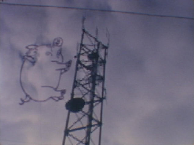 Image of Spider Pig walking up a Radio Tower